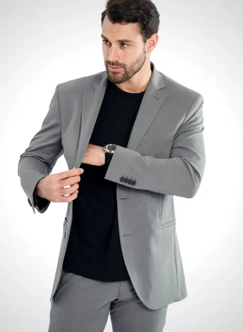 A Man Wearing Black Collarless Shirt With Grey Suit