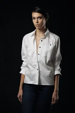 A Young Lady Wearing Black Chino With White Linen Shirt